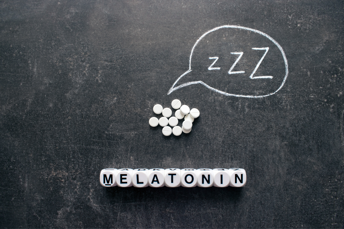 Melatonin supplement in black board.