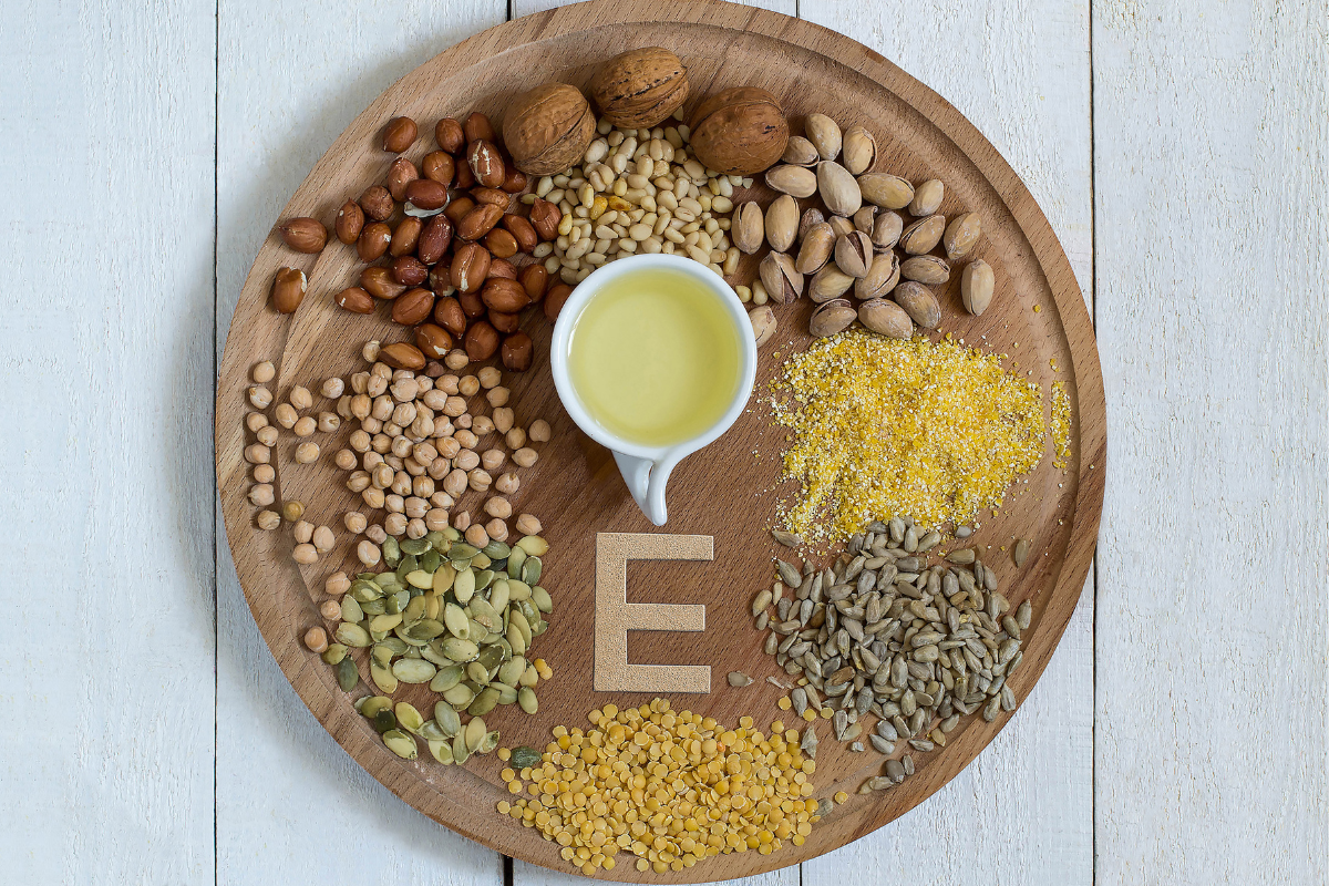 seeds & nuts rich vitamin e on wooden disc