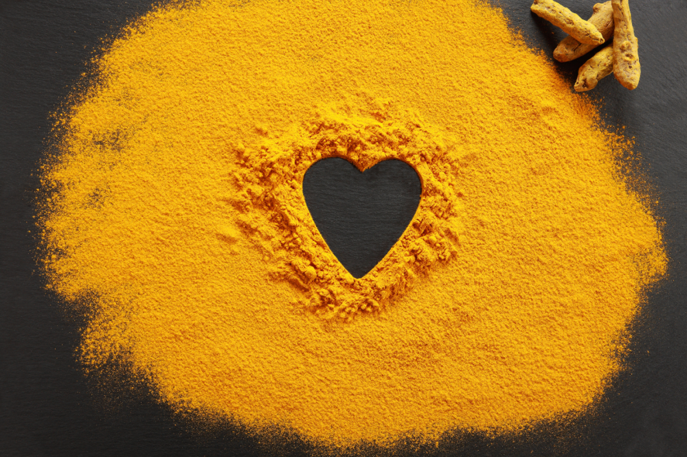 turmeric powder with the shape of a heart in the middle