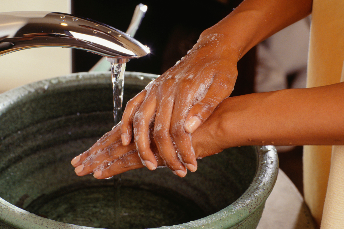 woman washes her hands